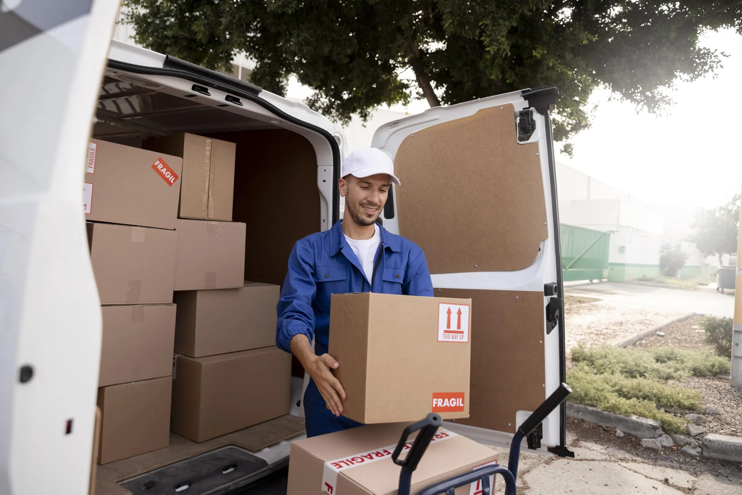 medium shot delivery man holding box scaled 1